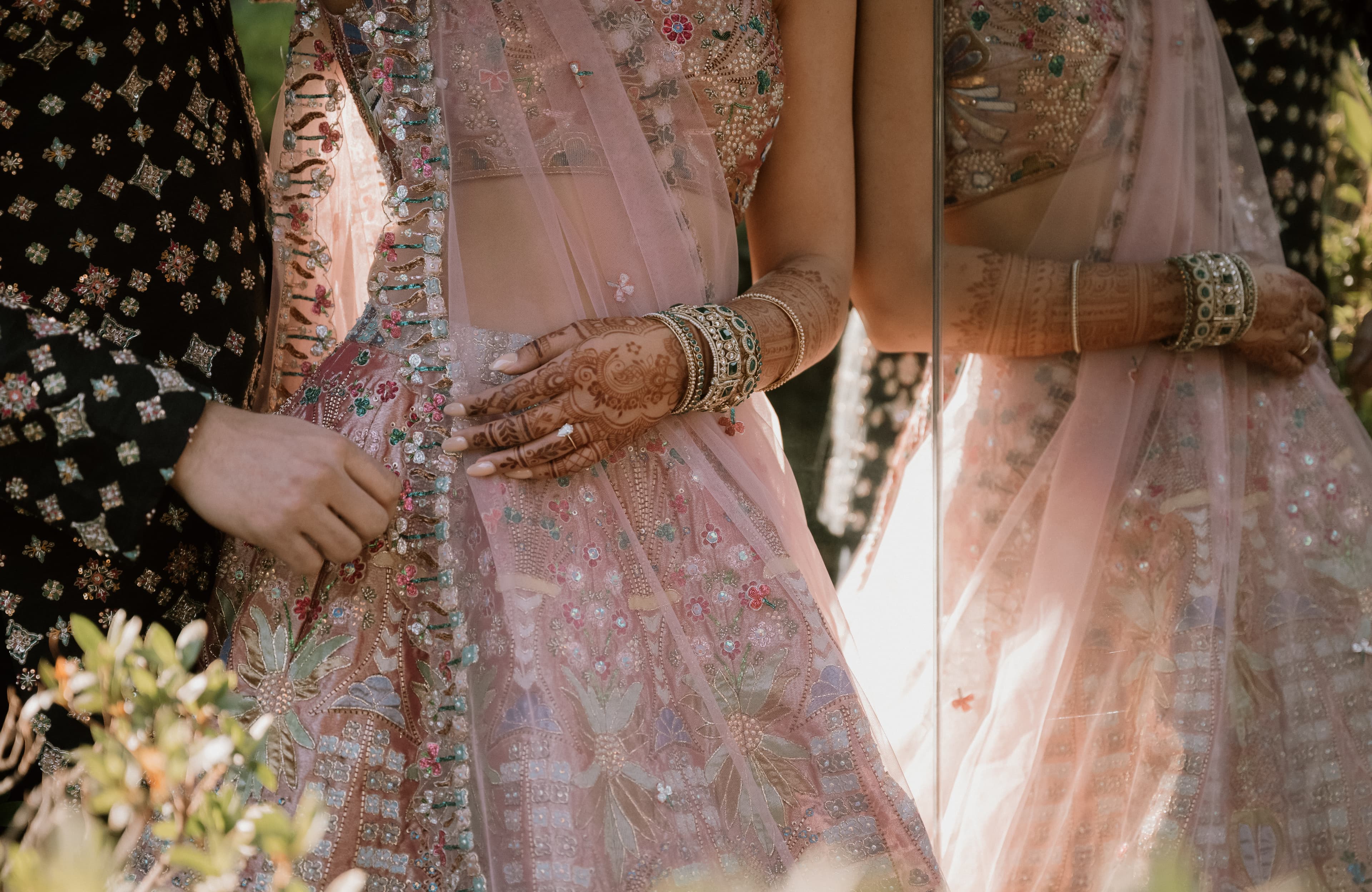 Mehndi detail — intricate henna patterns on bride's hands